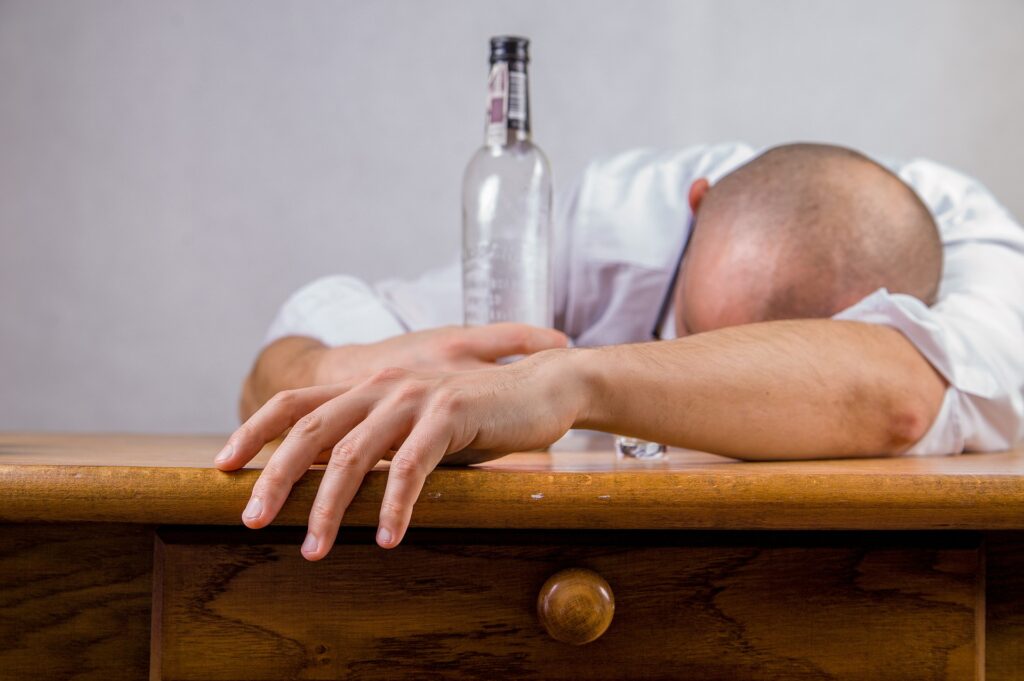 Alcohol consumption, such as what this man is doing, causes 85,000 deaths in the Americas.